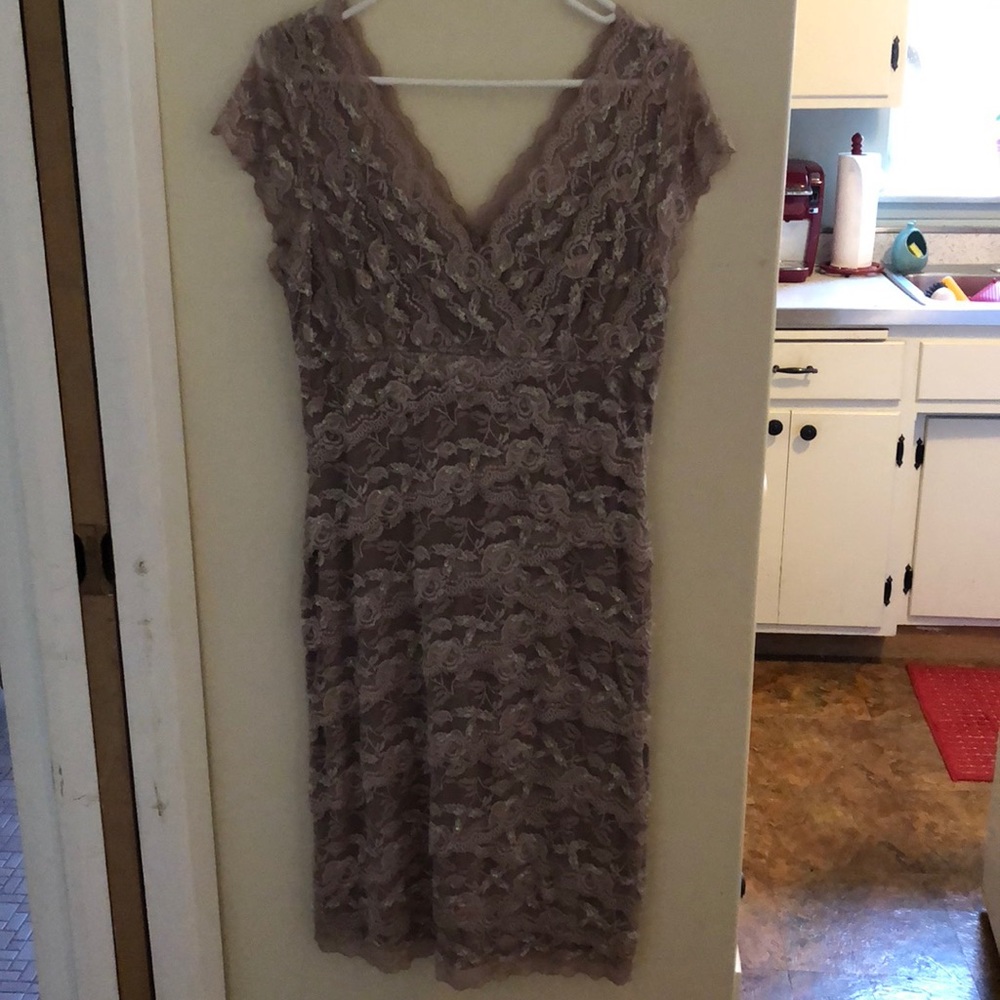 Stunning and flattering beige stretch lace dress.